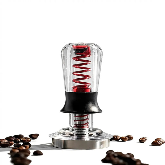 Tamper calibré IKAPE V3 avec ressort visible et grains de café